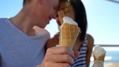 Close-up-of-happy-couple-holding-ice-cream-4k