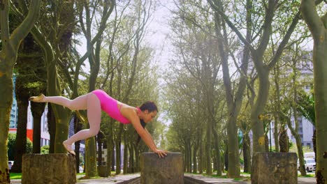 Young-female-dancer-practicing-handstand-in-the-park-4k