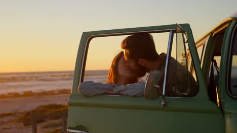 Romantic-couple-kissing-near-van-4k