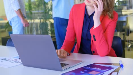 Front-view-of-caucasian-businesswoman--working-on-laptop-in-conference-room-4k