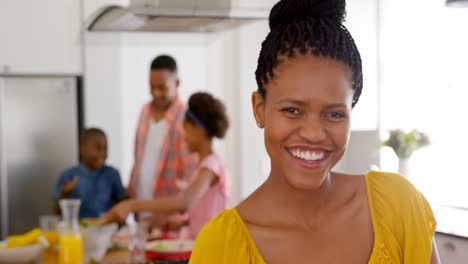 Front-view-of-happy-mid-adult-black-woman-looking-at-camera-in-a-comfortable-home-4k