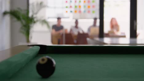 Close-up-of-snooker-ball-on-the-snooker-table-in-a-modern-office-4k