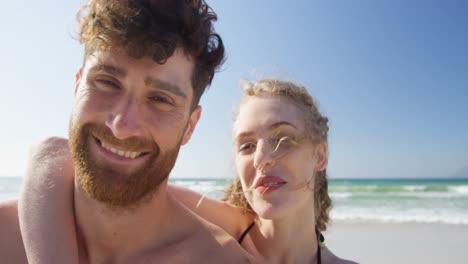 Romantic-couple-smiling-at-the-beach-4k