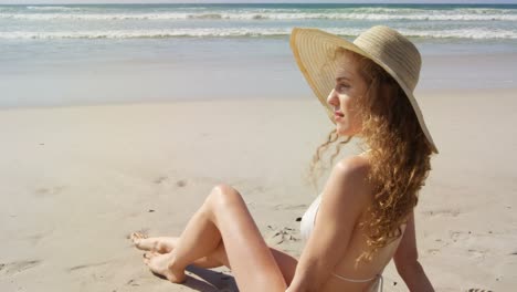 Woman-relaxing-at-beach-on-a-sunny-day-4k