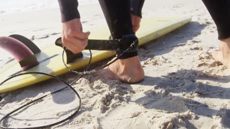 Male-surfer-wears-safety-leash-to-the-ankle-4k