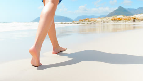 Low-section-of-woman-walking-at-beach-on-a-sunny-day-4k