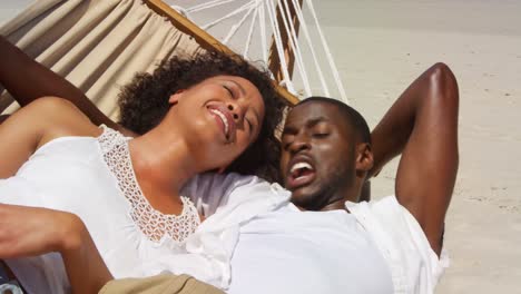 Couple-interacting-with-each-other-while-lying-in-a-hammock-4k