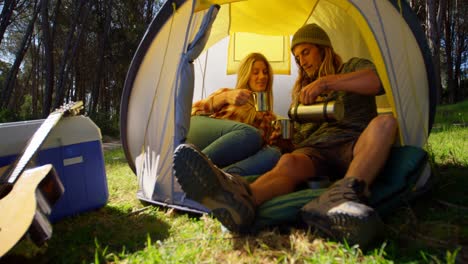 Young-couple-having-coffee-in-tent-4k