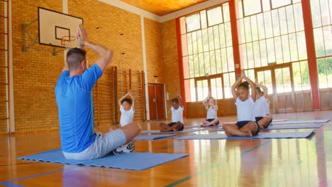 Yoga-instructor-teaching-yoga-to-school-kids-in-school-4k