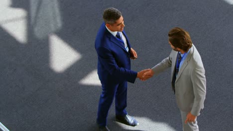 Caucasian-businessmen-shaking-hands-in-the-office-4k