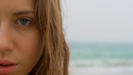 Close-up-of-Caucasian-woman-standing-on-the-beach-4k