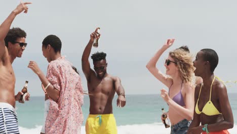 Group-of-mixed-race-friends-dancing-together-on-the-beach-4k