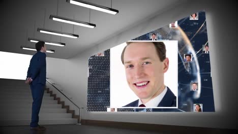 Businessman-looking-at-projector-screen-with-pictures