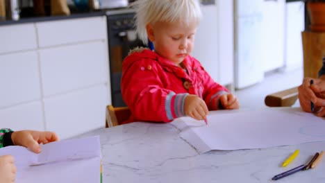 Father-helping-his-daughter-in-drawing-at-home-4k