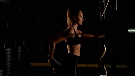 Female-athlete-exercising-in-fitness-studio-4k