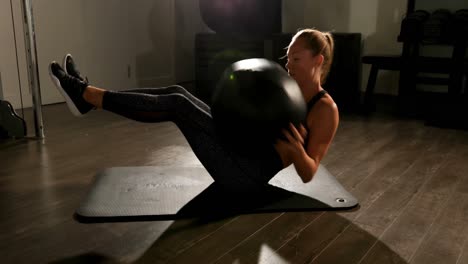 Female-athlete-practicing-twist-exercise-4k