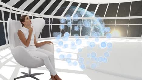 Digital-app-icons-and-a-woman-in-a-white-room