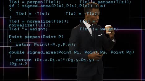 Businessman-using-a-smart-coffee-while-drinking-coffee