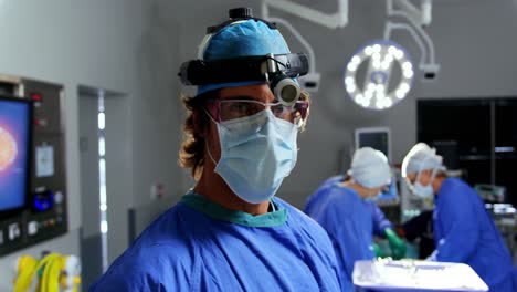 Female-surgeon-standing-at-hospital-4k