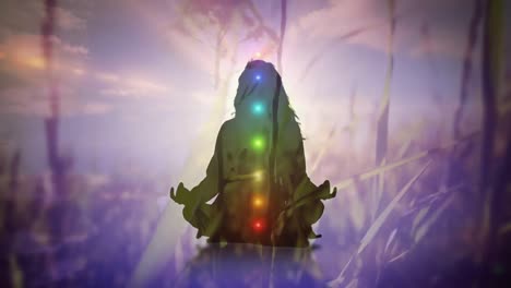 Woman-meditating-and-colored-chakras