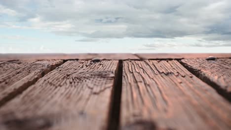 Wooden-deck-with-a-view-of-cloudy-skies