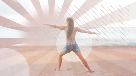 Woman-doing-yoga-at-the-beach