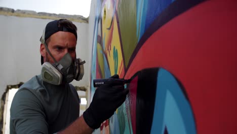 Graffiti-artist-painting-with-marker-on-the-wall-4k