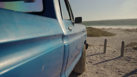 Pickup-truck-parked-on-the-beach-4k