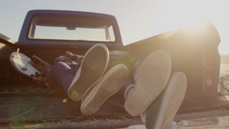 Couple-relaxing-in-pickup-truck-at-beach-4k