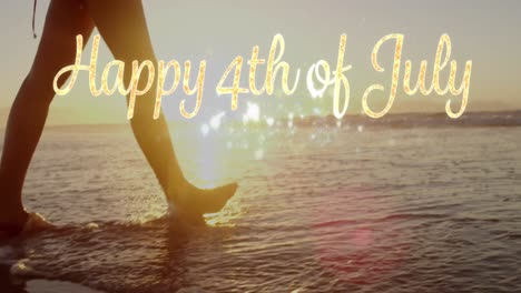 Happy-4th-of-July-greeting-and-a-woman-walking-by-the-beach-4k