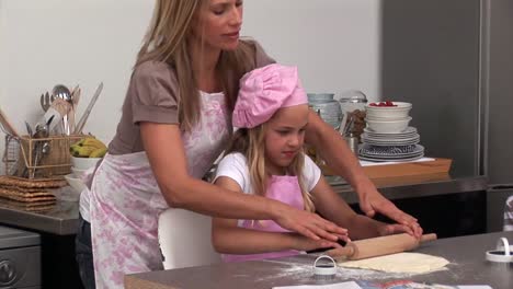 Beautiful-woman-preparing-a-meal-with-her-daughter