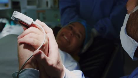 Close-up-of-Caucasian-man-comforting-pregnant-woman-during-labor-in-operation-theater-4k