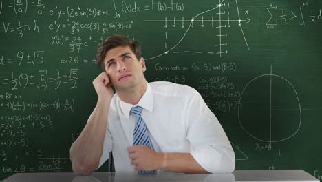 Man-sitting-and-thinking-in-front-of-moving-maths-calculations-on-chalkboard-4k
