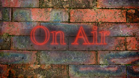 On-Air-red-neon-graphic-on-brick-wall