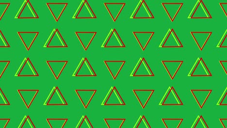 Triángulos-Giratorios-En-Formación-Sobre-Un-Fondo-Verde.