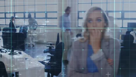 Woman-working-in-an-office-with-grid-moving-in-the-foreground