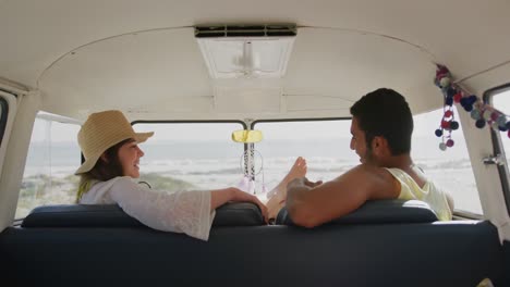 Young-adult-couple-talking-in-a-camper-van-4k