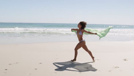 Young-woman-running-at-the-beach-4k