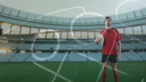 Animation-of-position-plan-over-caucasian-man-with-rugby-ball-at-stadium