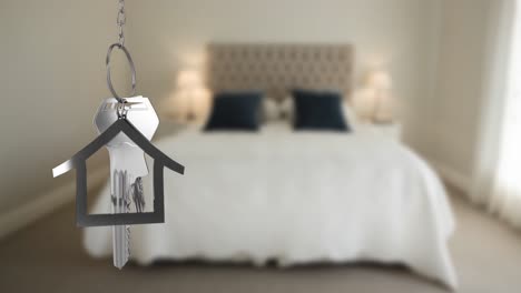 House-keys-and-key-fob-hanging-over-out-of-focus-bedroom-4k