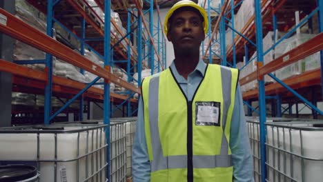 Male-worker-walking-in-a-warehouse
