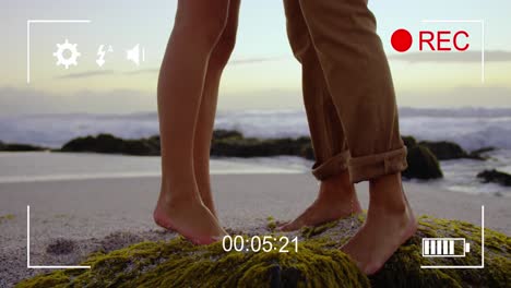 Filming-a-couple-on-a-beach-on-a-digital-camera-4k