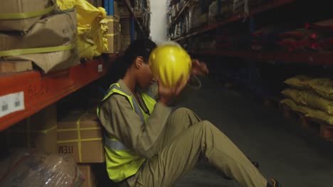 Young-female-male-worker-in-a-warehouse