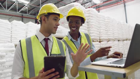 Young-managers-interacting-in-a-warehouse