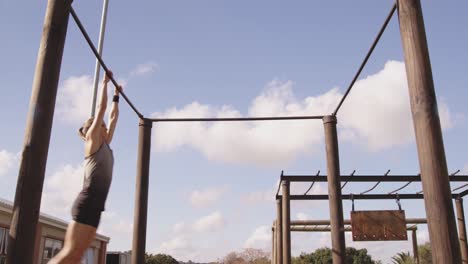 Young-woman-training-at-an-outdoor-gym-bootcamp