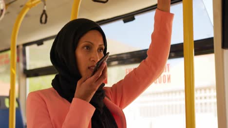 Young-woman-wearing-hijab-commuting-on-a-bus