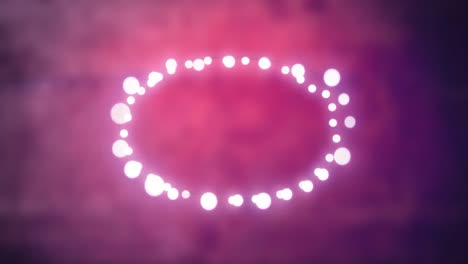 Glowing-oval-of-fairy-lights-on-pink-background