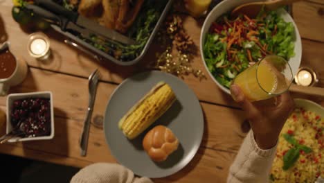 Millennial-adult-friends-celebrating-Thanksgiving-together-at-home-