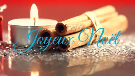 Joyeux-NoÃ«l-written-over-Christmas-candle