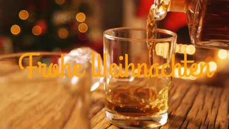 Frohe-Weihnachten-Written-Over-Drink-Being-Poured